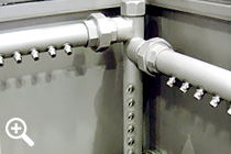 Spray nozzles and pipelines of a cabinet parts washer